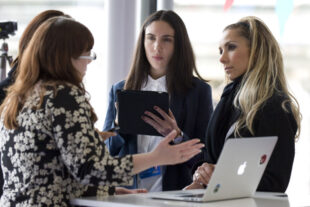 Photo of four women civil servants in a meeting