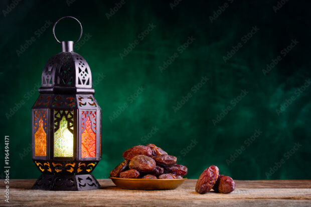 A lantern and a bowl of dates